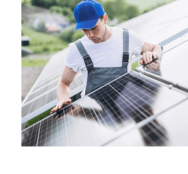 Worker installing solar panel